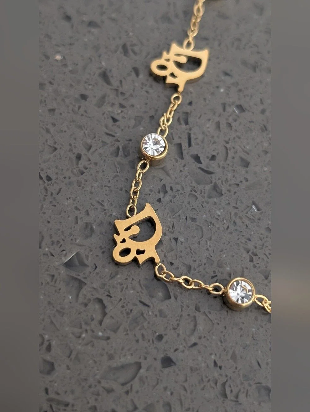 Gold-Tone Script Charm Bracelet with Clear Crystal Accents Stainless Steel